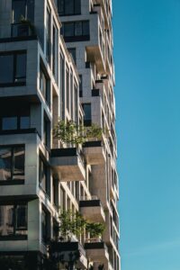 Stunning urban architecture shown in a modern residential building and balconies with blue skies.